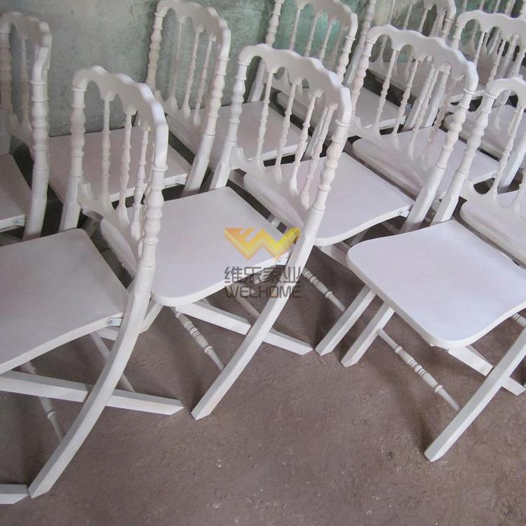 White wooden napoleon folding chair with cushion for wedding/event